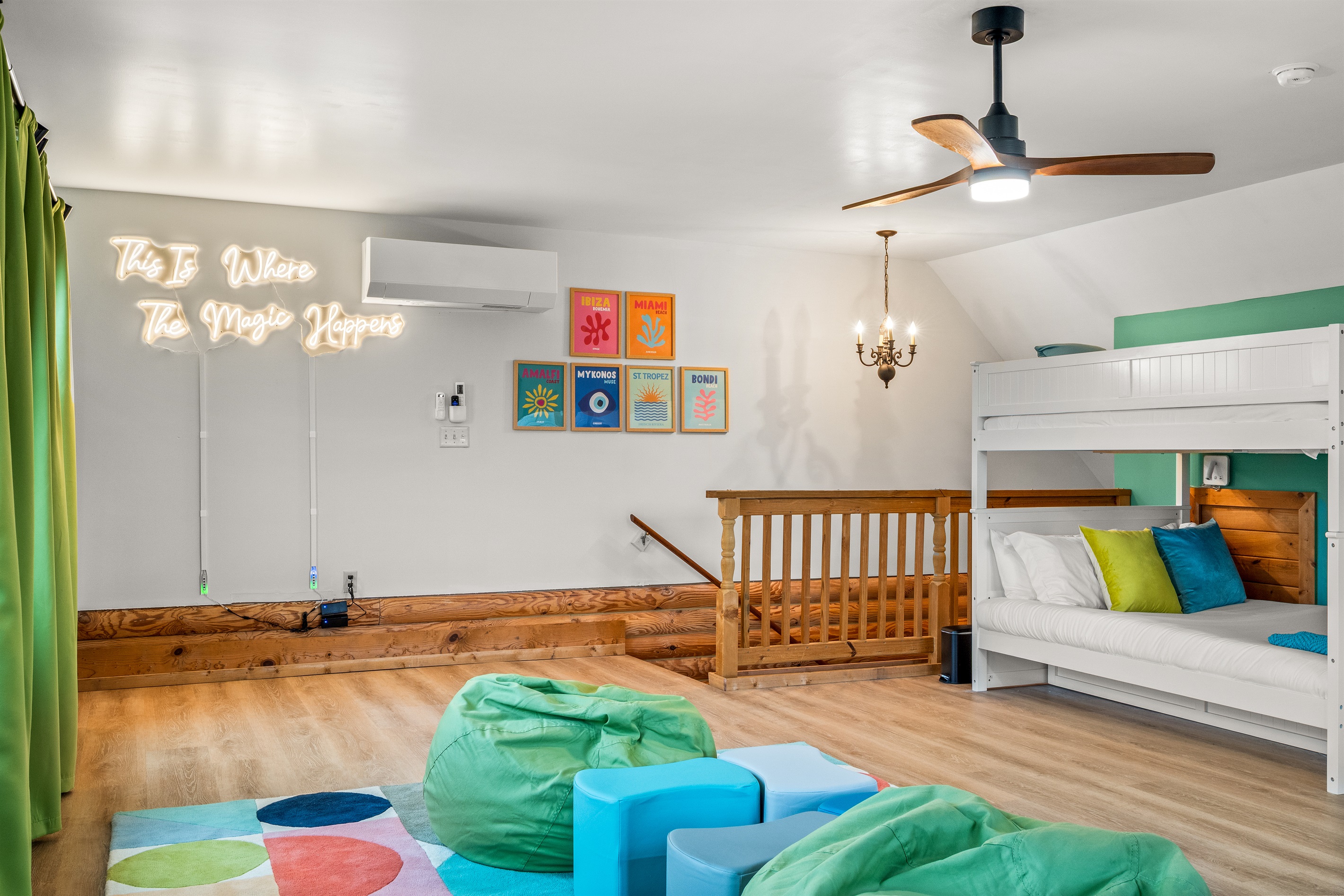 Kid-friendly room with two full bunk beds and a cozy hangout area.