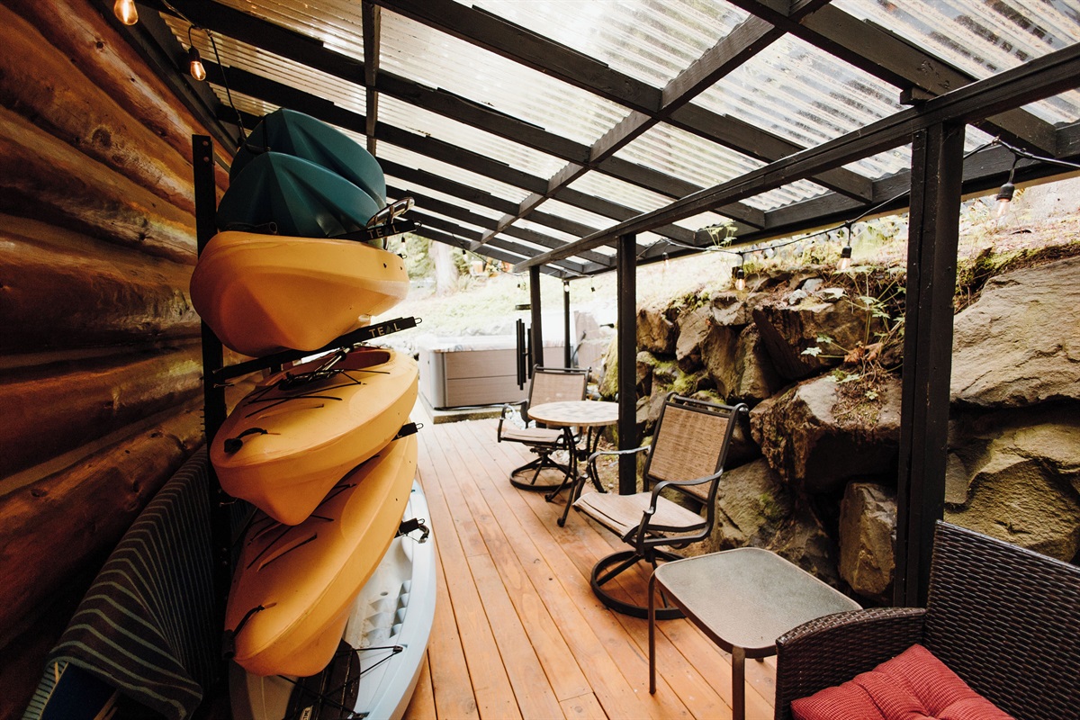 Back deck, hot tub access, private seating area and kayak storage.
