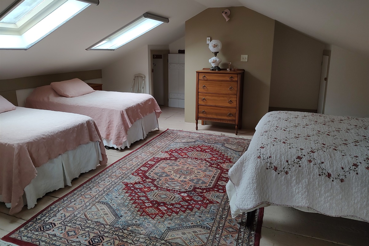 2 Twin beds and a queen bed in sleeping loft.
