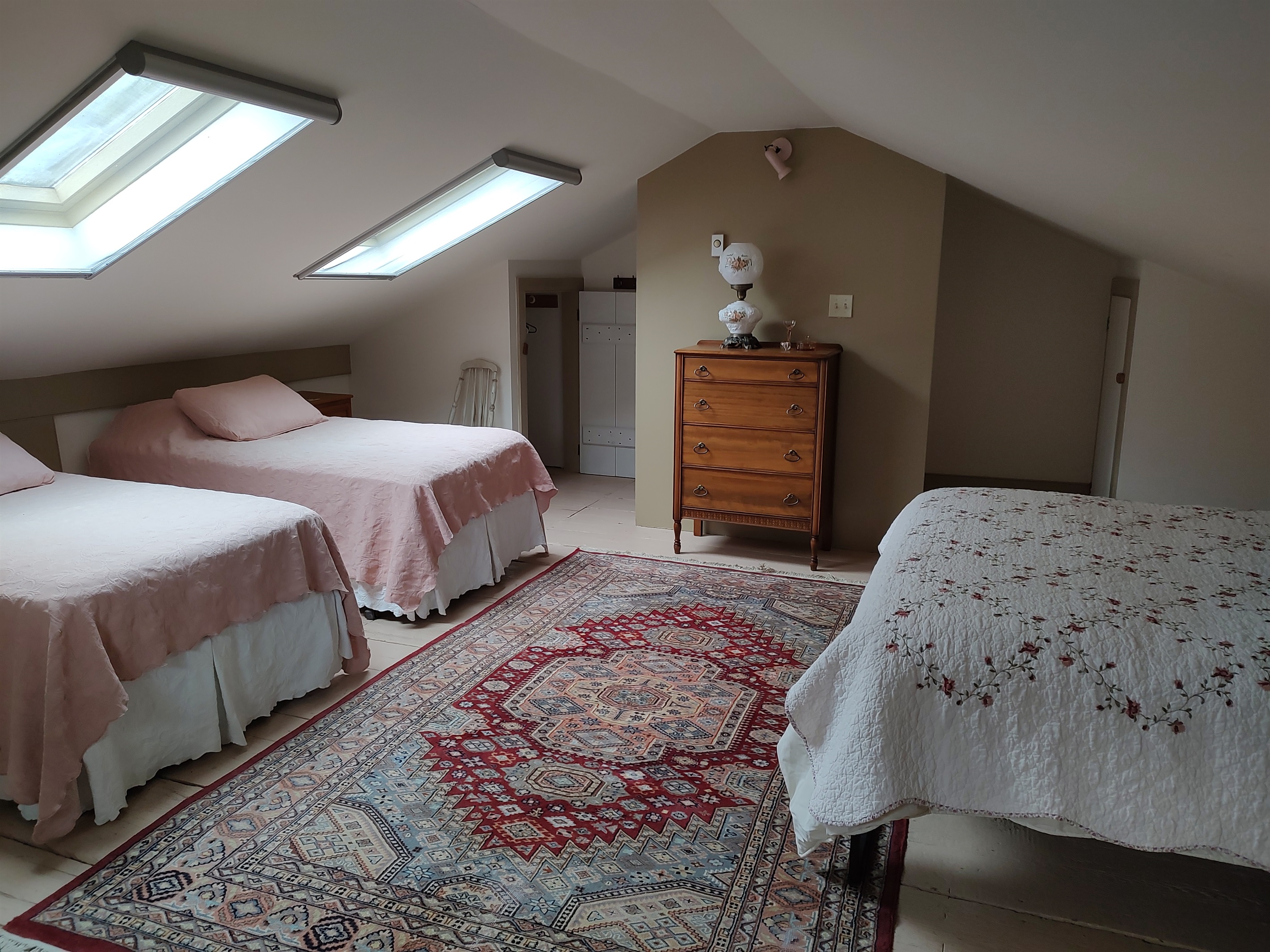 2 Twin beds and a queen bed in sleeping loft.