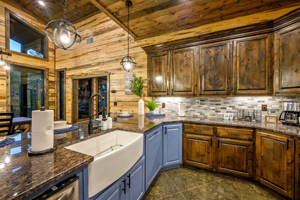 Modern rustic kitchen featuring granite counters and warm under-cabinet glow.
