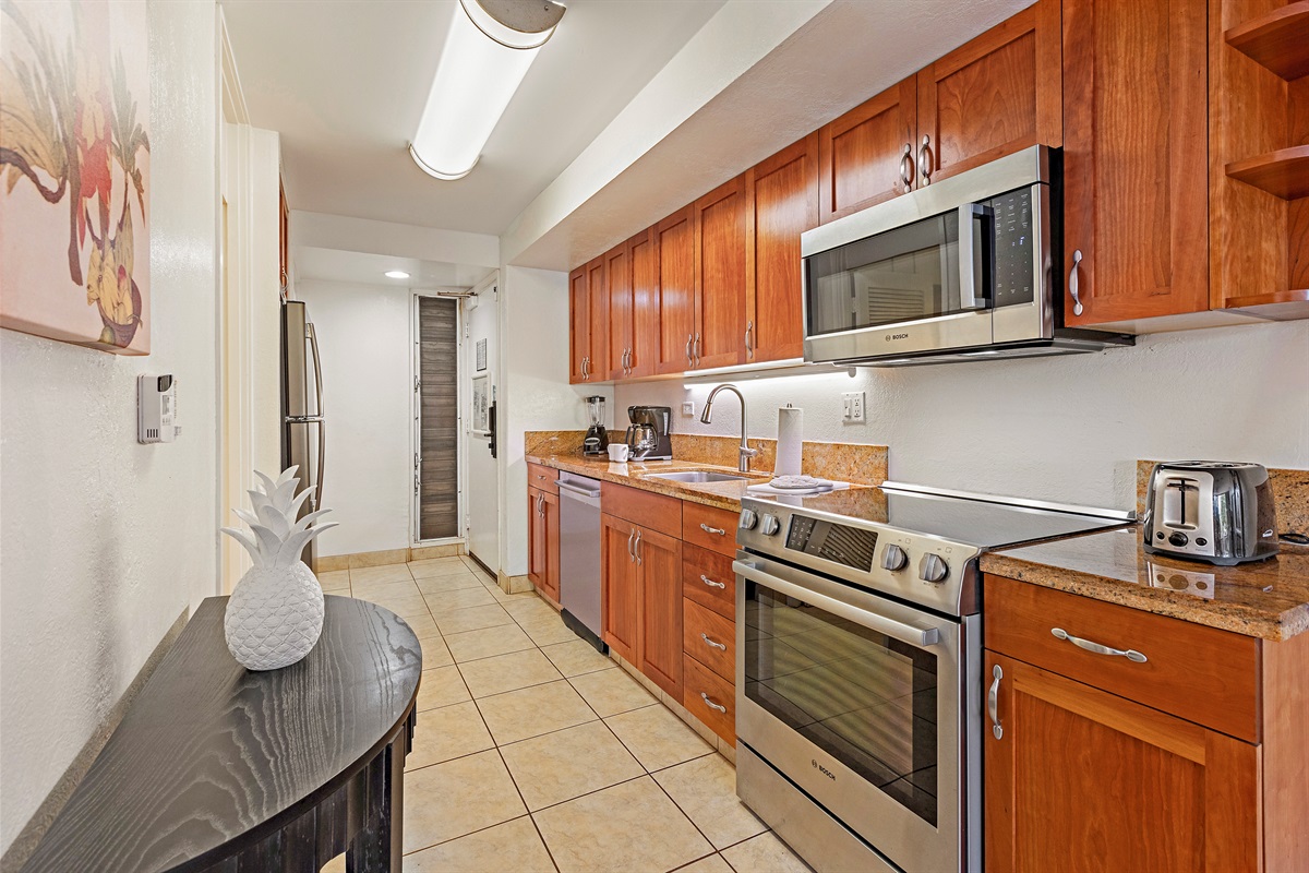 Well-equipped kitchen with modern appliances and ample counter space, great for preparing home-cooked meals