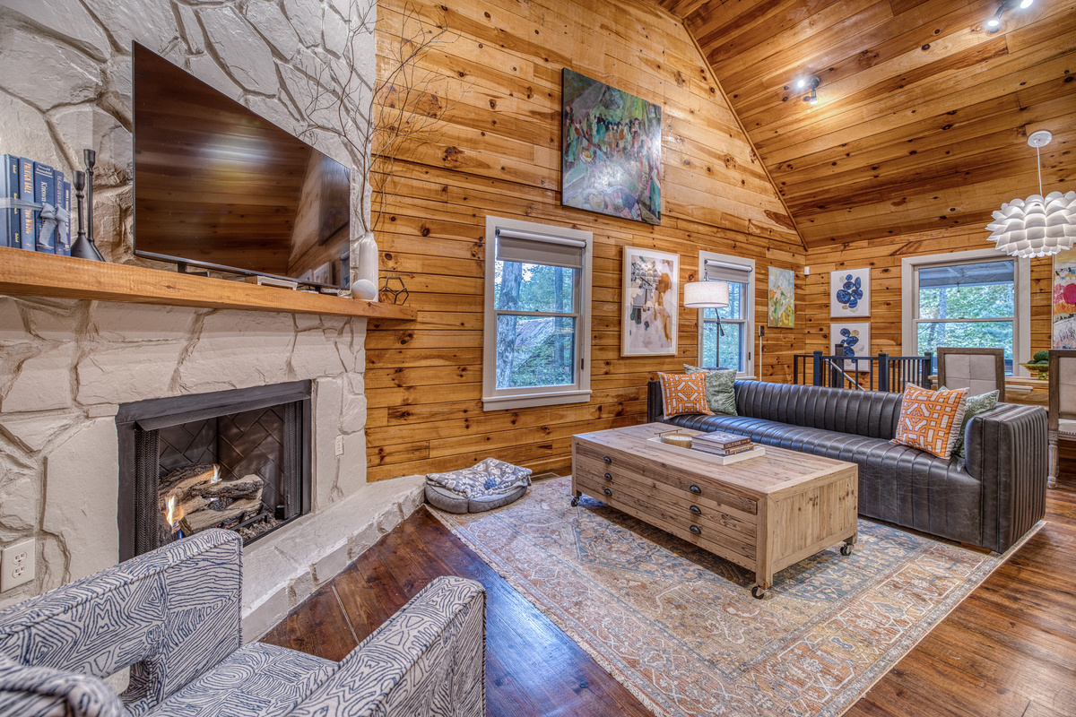 Living room with a fireplace and sofa.