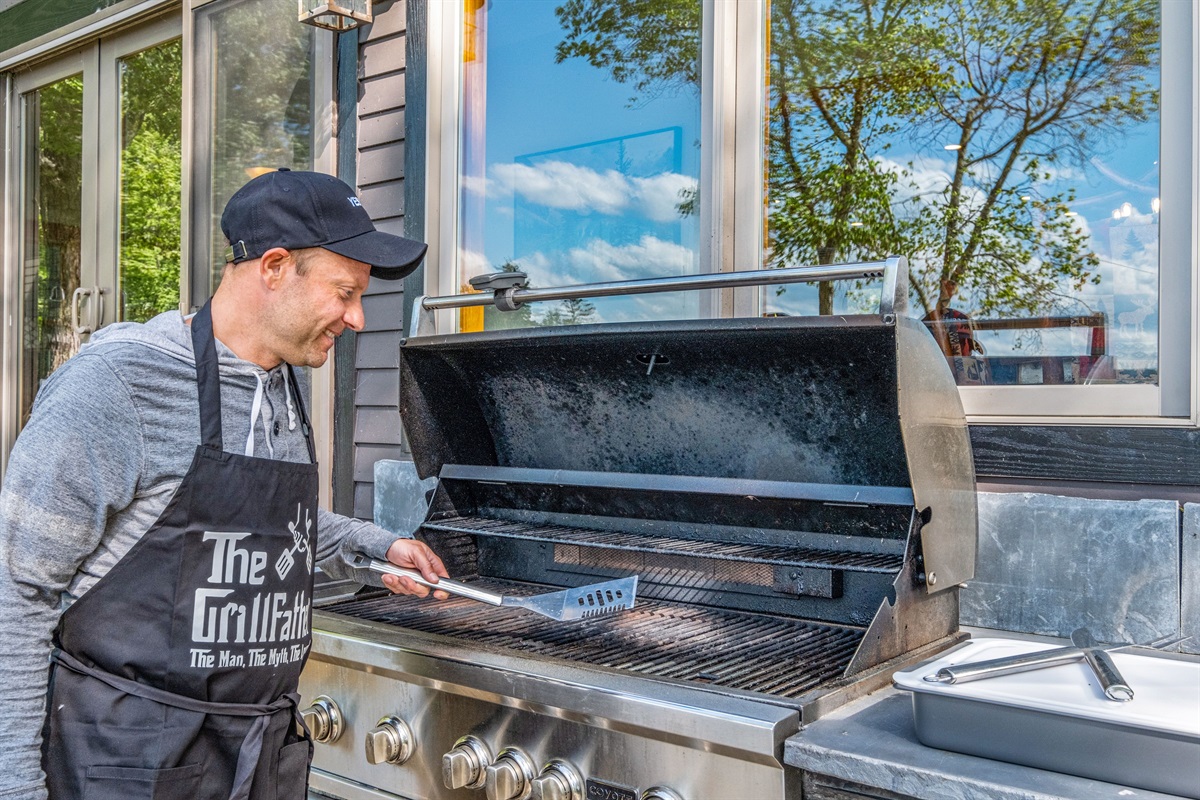 Grill center with massive grill, side burner, and fridge