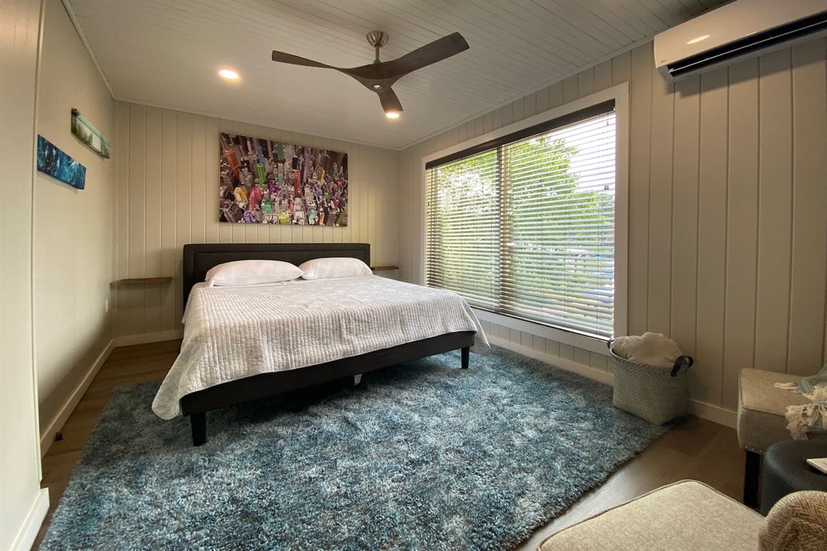 The King Bed features a Purple Mattress, Lake Views, Bedside Tables, a Smart TV and a Mini Split for Maximum Climate Control!
