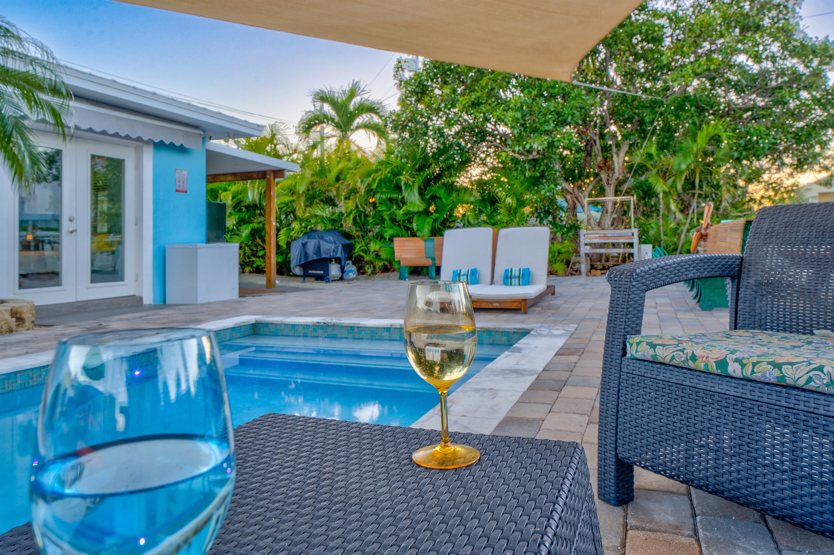 Enjoy your favorite cocktail in a tropical private back yard.