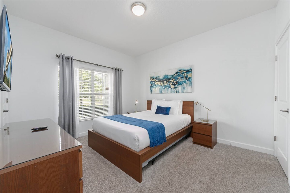 This is the downstairs bedroom with a queen bed