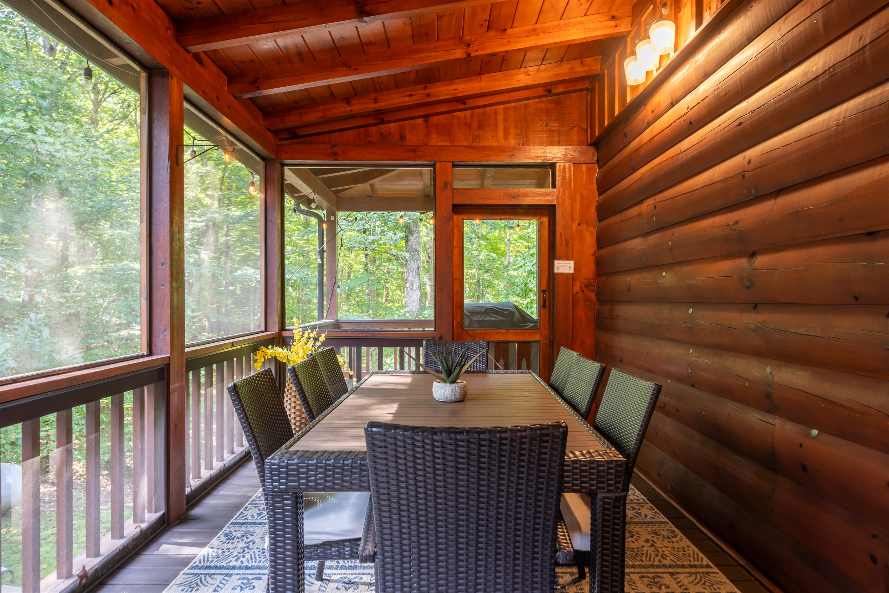 Outside dining area in screened-in room