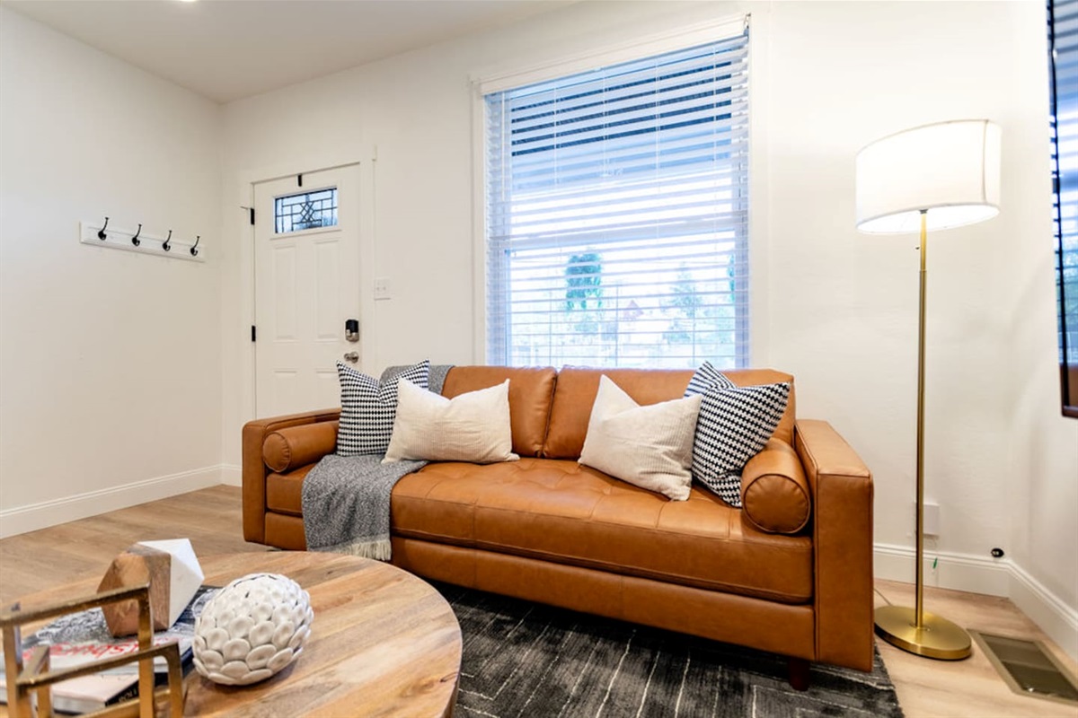 Stylish and comfortable couch in the spacious living area, perfect for unwinding after a long day.