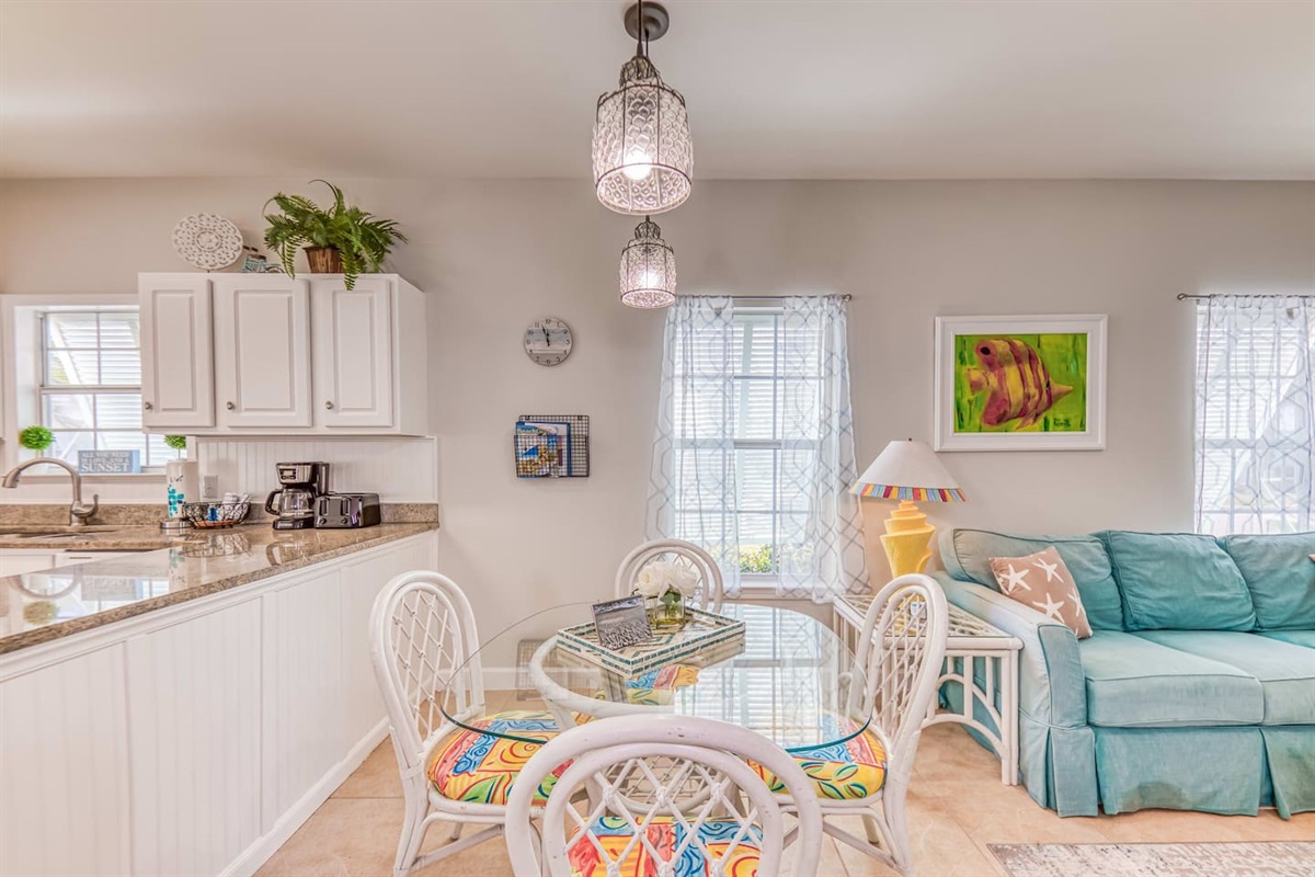 Dining Area: Bright colors meet beach vibes in this charming space for meals and laughter!