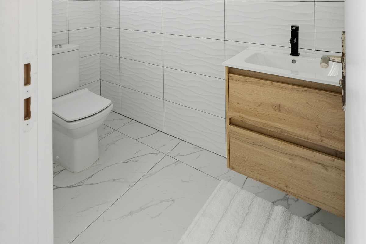 Convenient first-floor half bath for quick access.