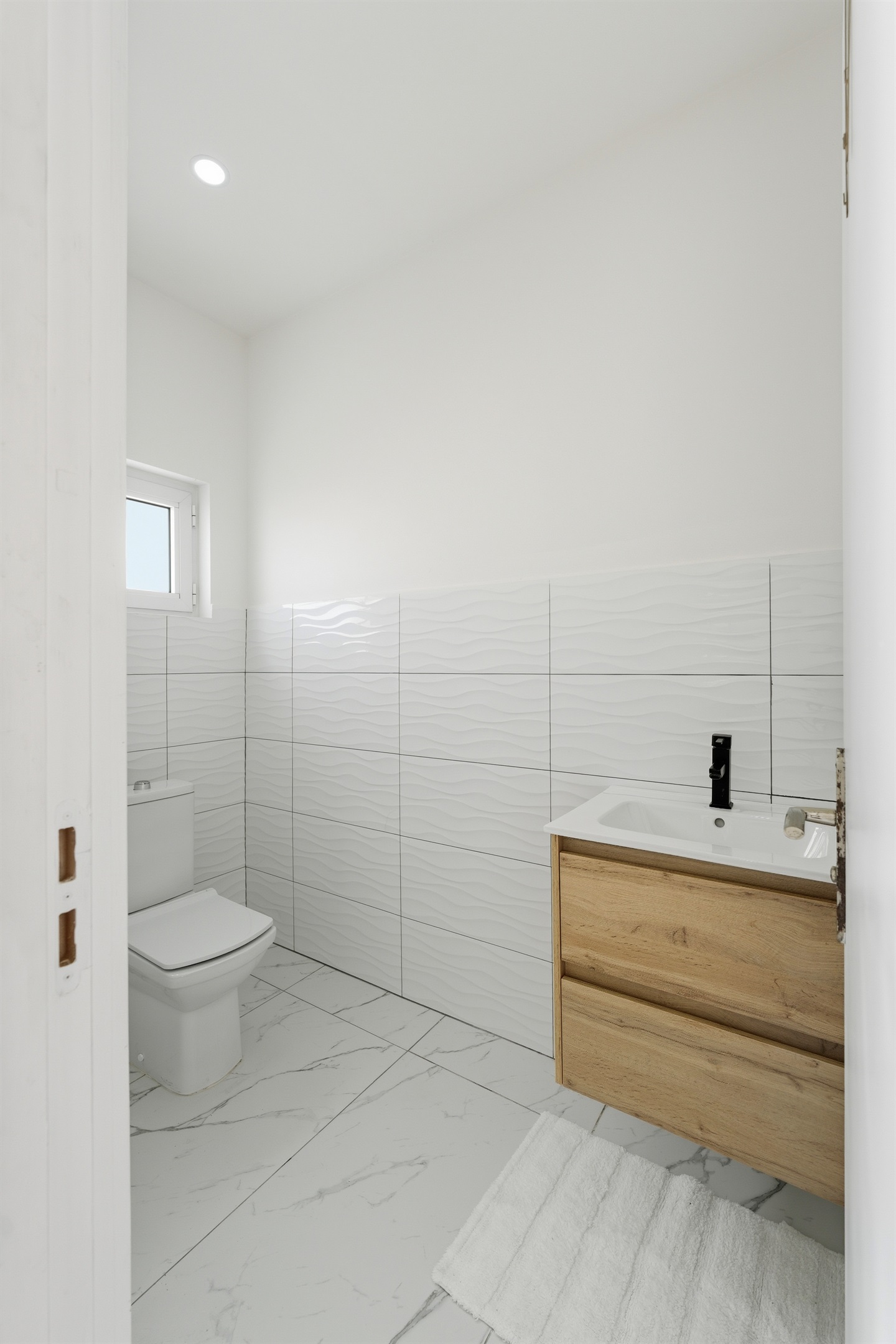 Convenient first-floor half bath for quick access.