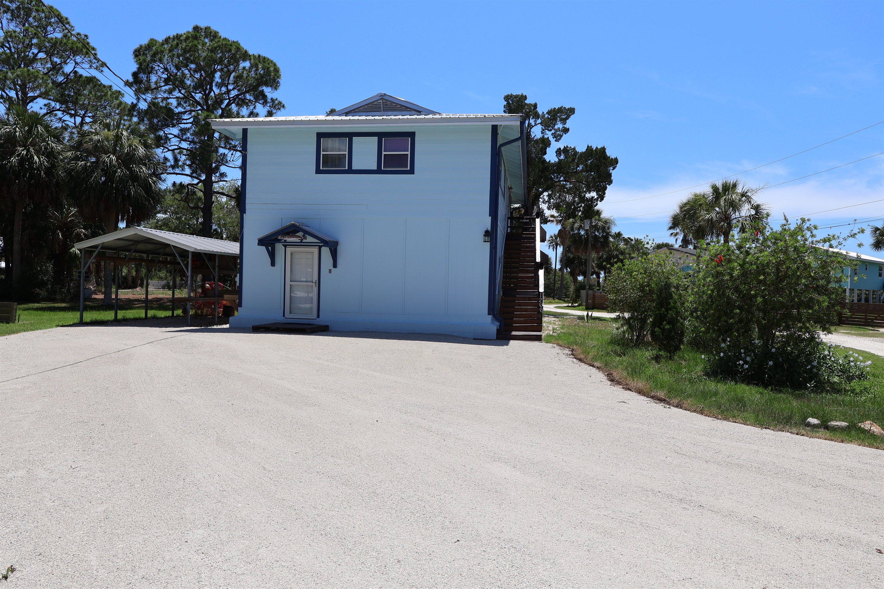 Large driveway for car, golf cart, or boat parking