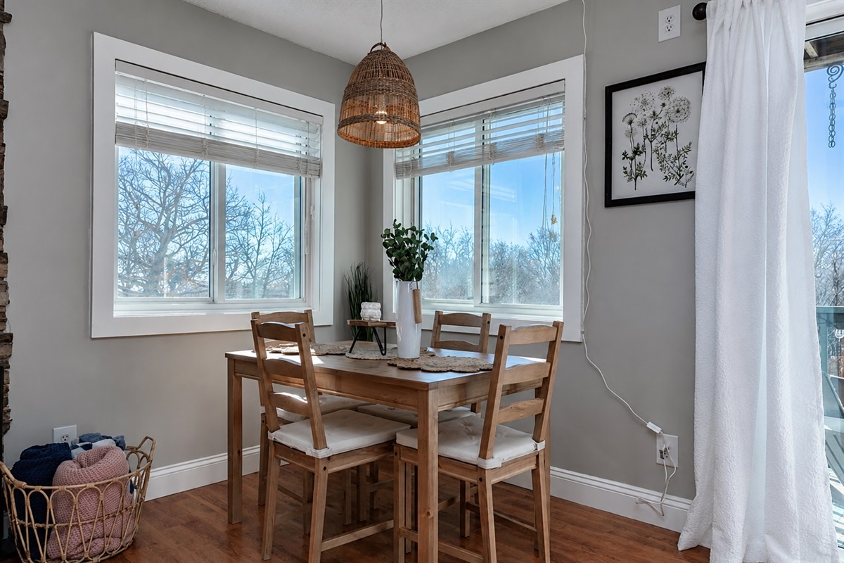 Dining area for four. Additional seating available on chairs and sofa with tray tables for dining. Cook, gather, and connect—everything you need is here