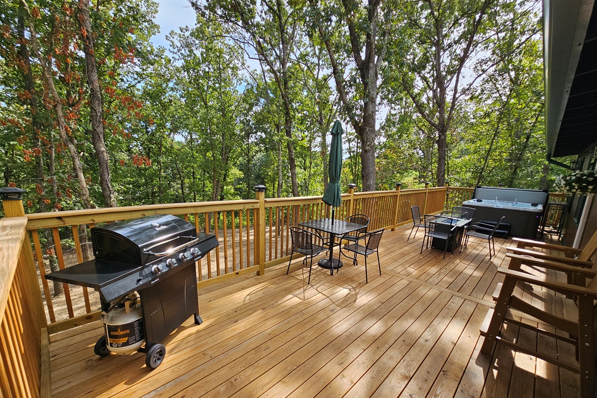 Fire up the grill, sip a drink at the table, or unwind in the hot tub — this deck has space for everyone.