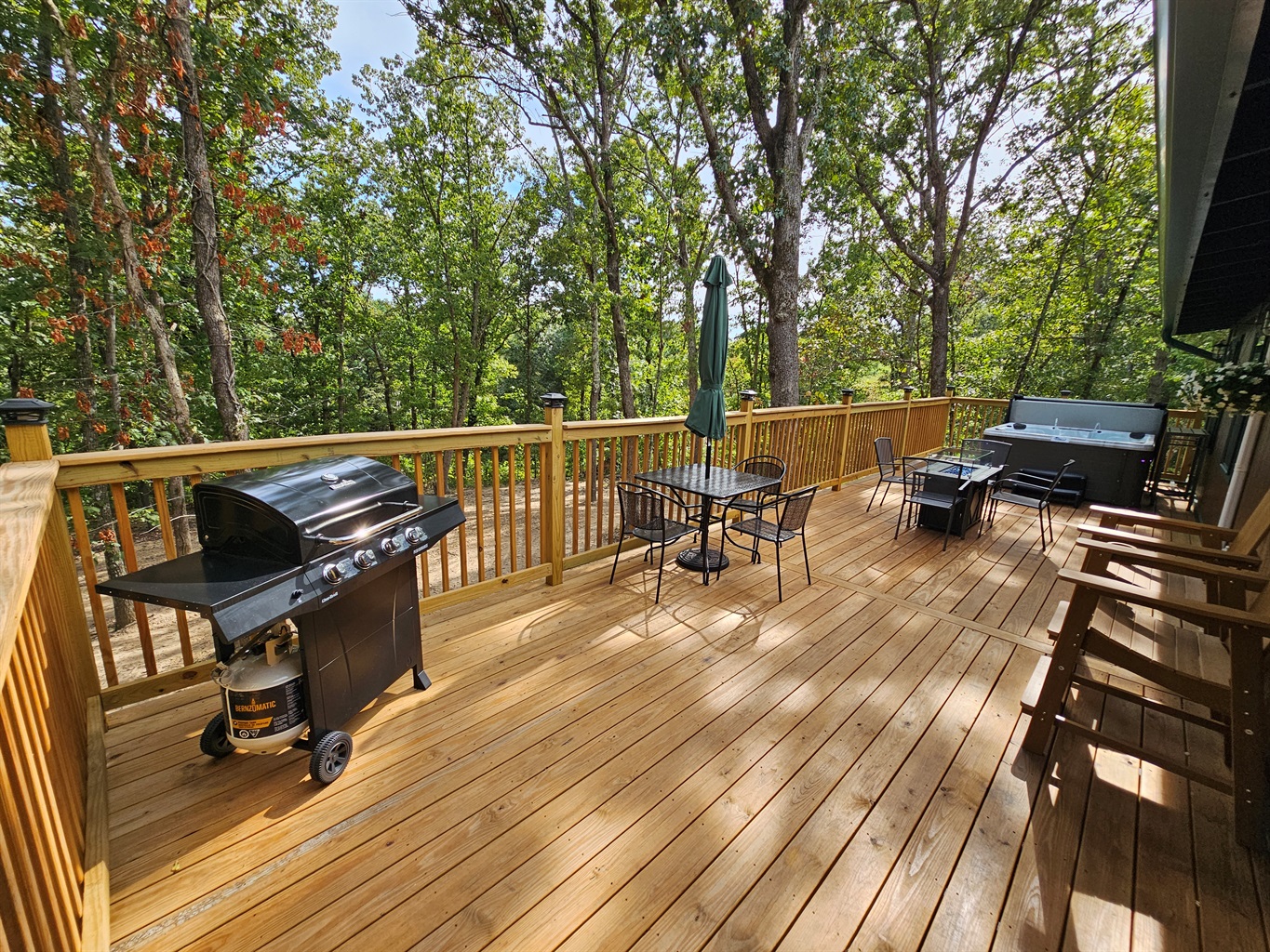 Fire up the grill, sip a drink at the table, or unwind in the hot tub — this deck has space for everyone.