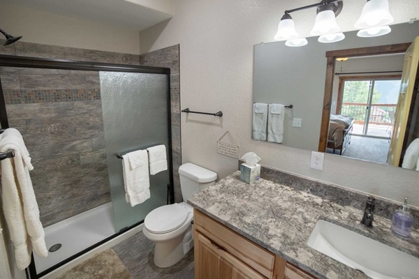 Main Level Bedroom En Suite Bathroom 1 with modern rustic touches with convenient access.