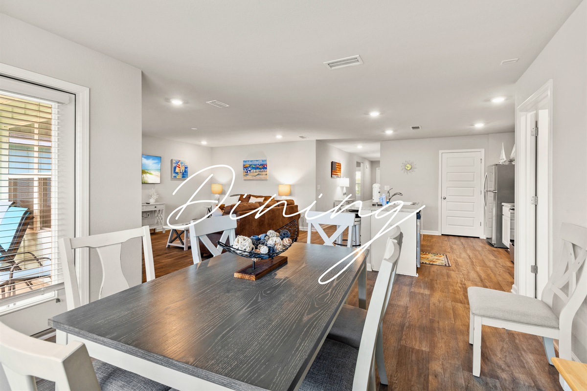 Dining table ready for game nights, shared meals, and plenty of family fun after a beach day.