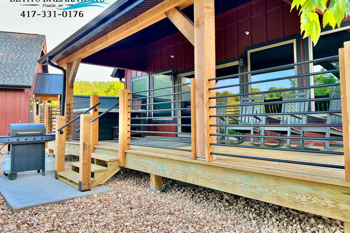 Trout Hideaways back porch just steps away from walking trails along the lake!