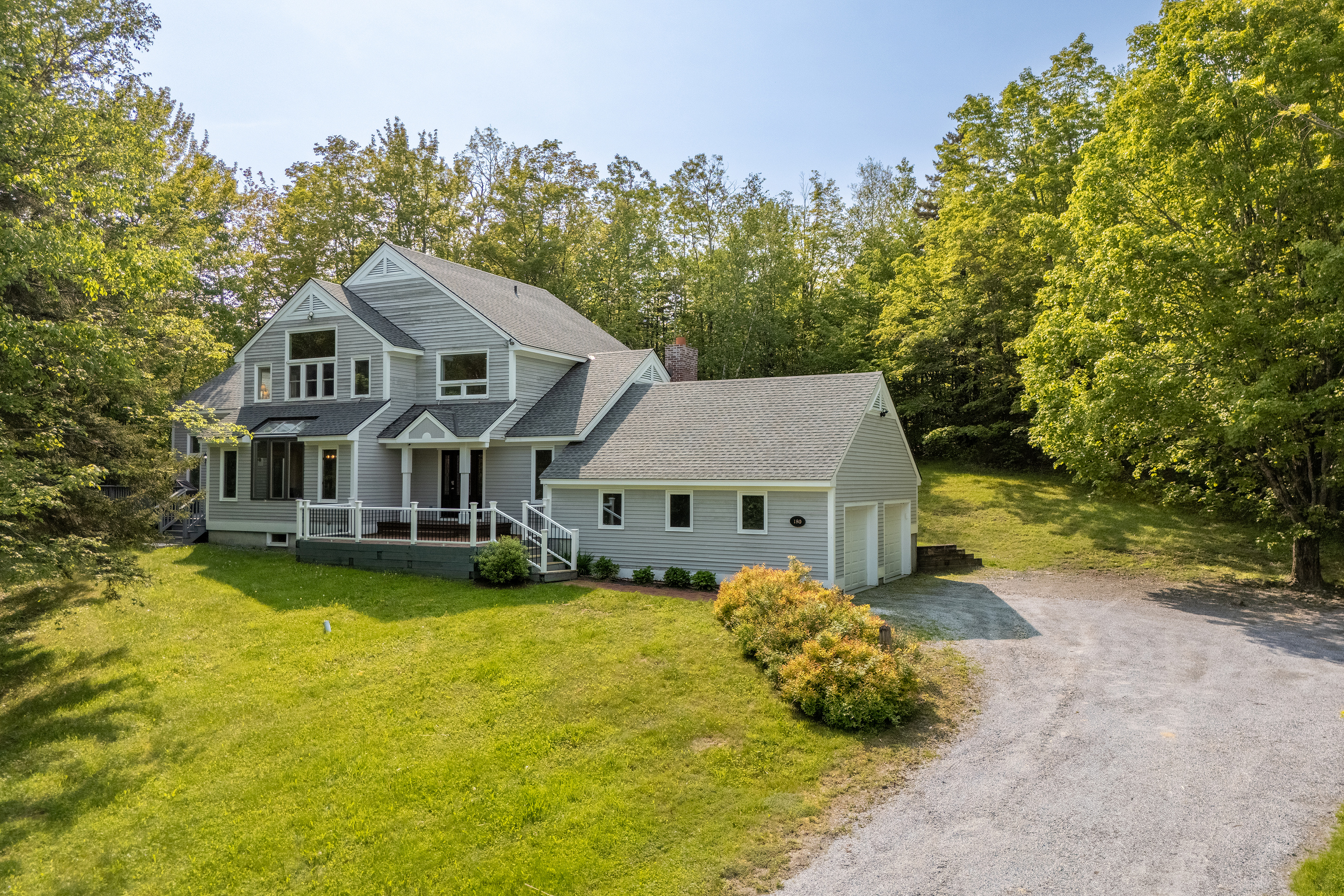 Front exterior of First Chair Lair, a five-bedroom ski house in the High Meadow subdivision of Winhall, Vermont