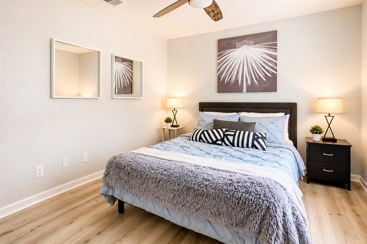 Bright living space with sliding glass doors, comfortable seating area, and contemporary lighting design.