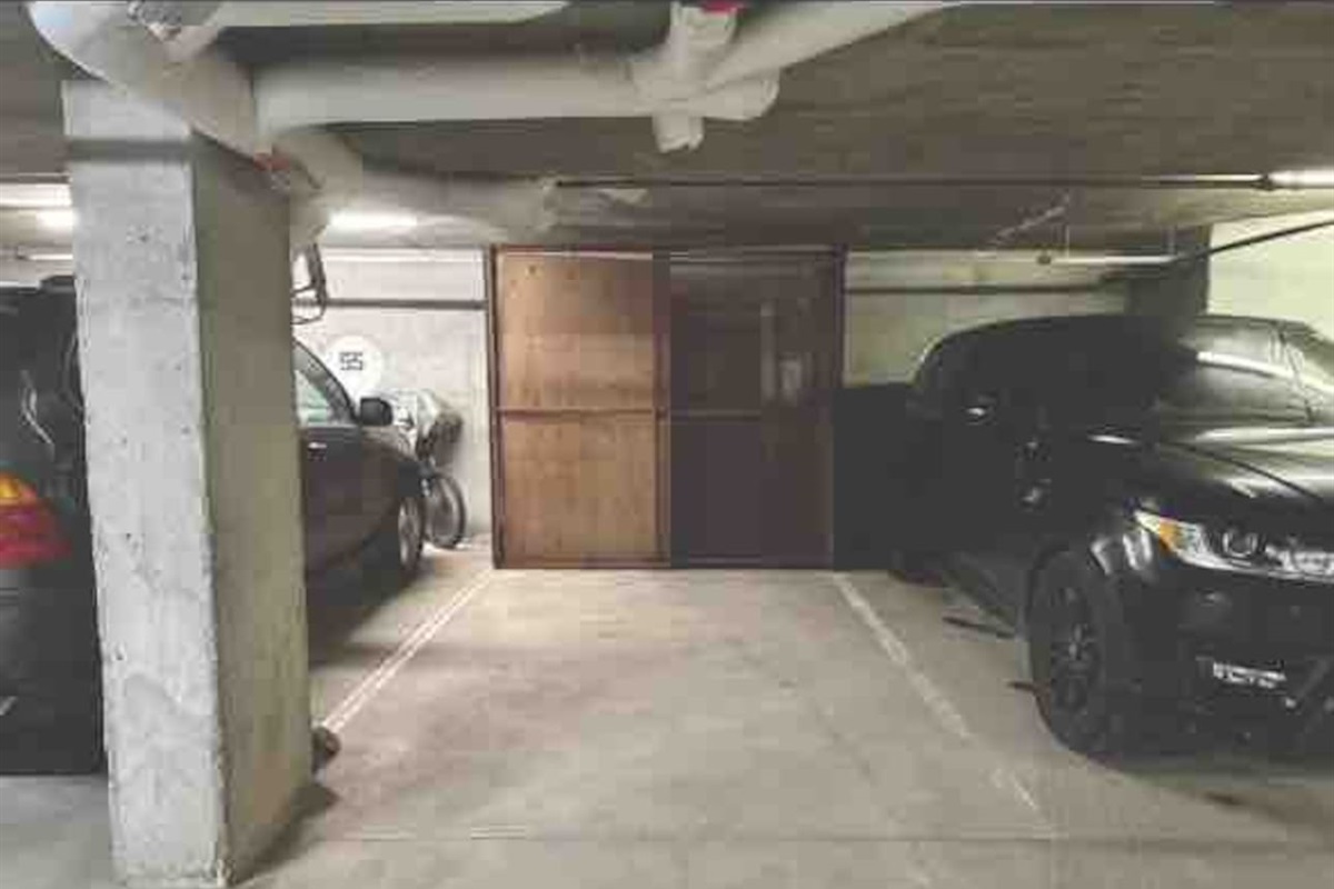 Secure private parking stall with bike & equipment storage cage