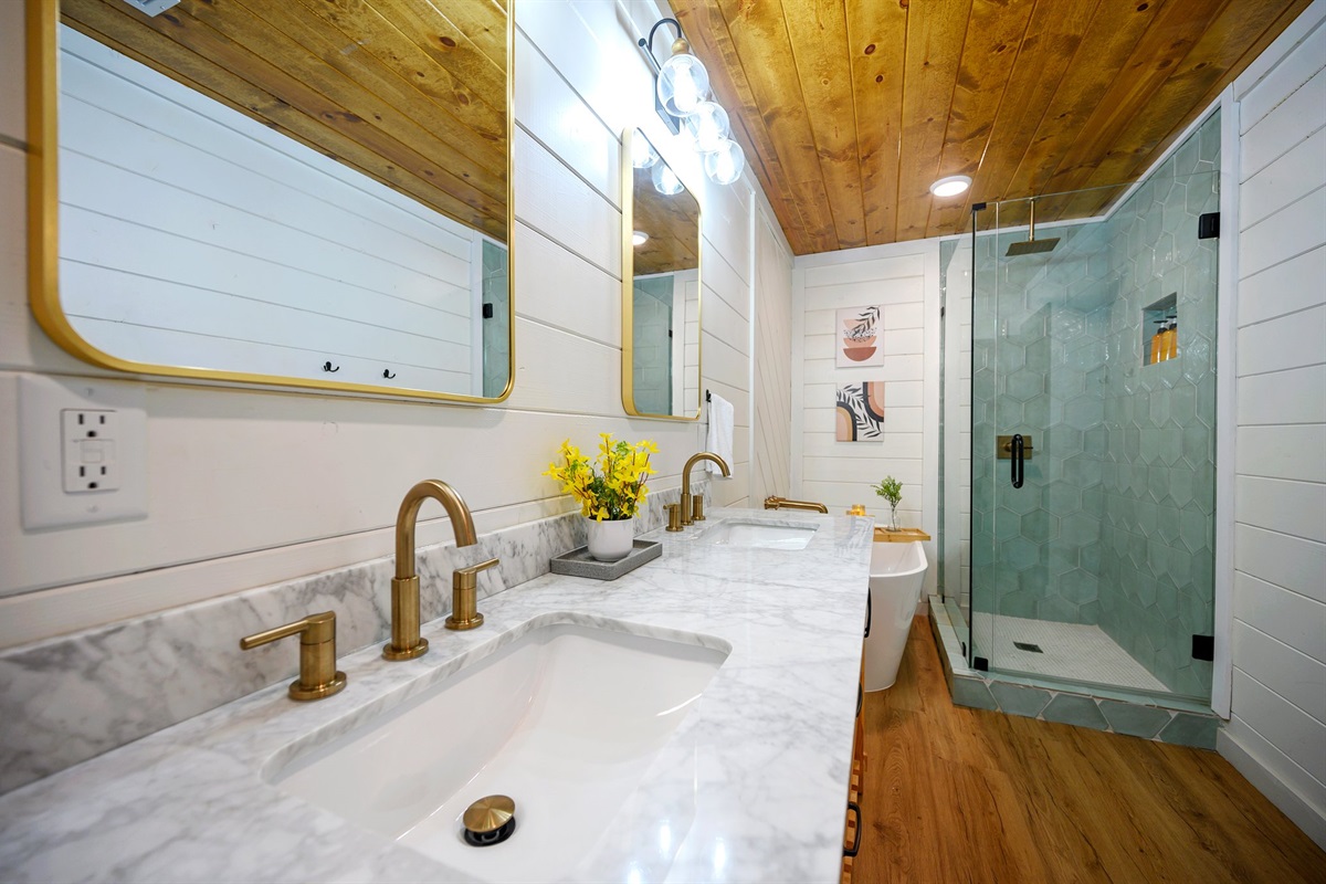 Upscale design with gold accents and a walk-in rain shower.