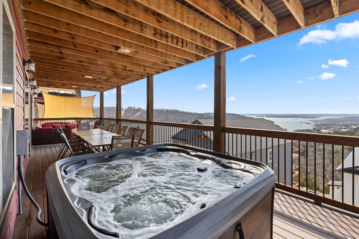 Relax in the hot tub while enjoying the lake views