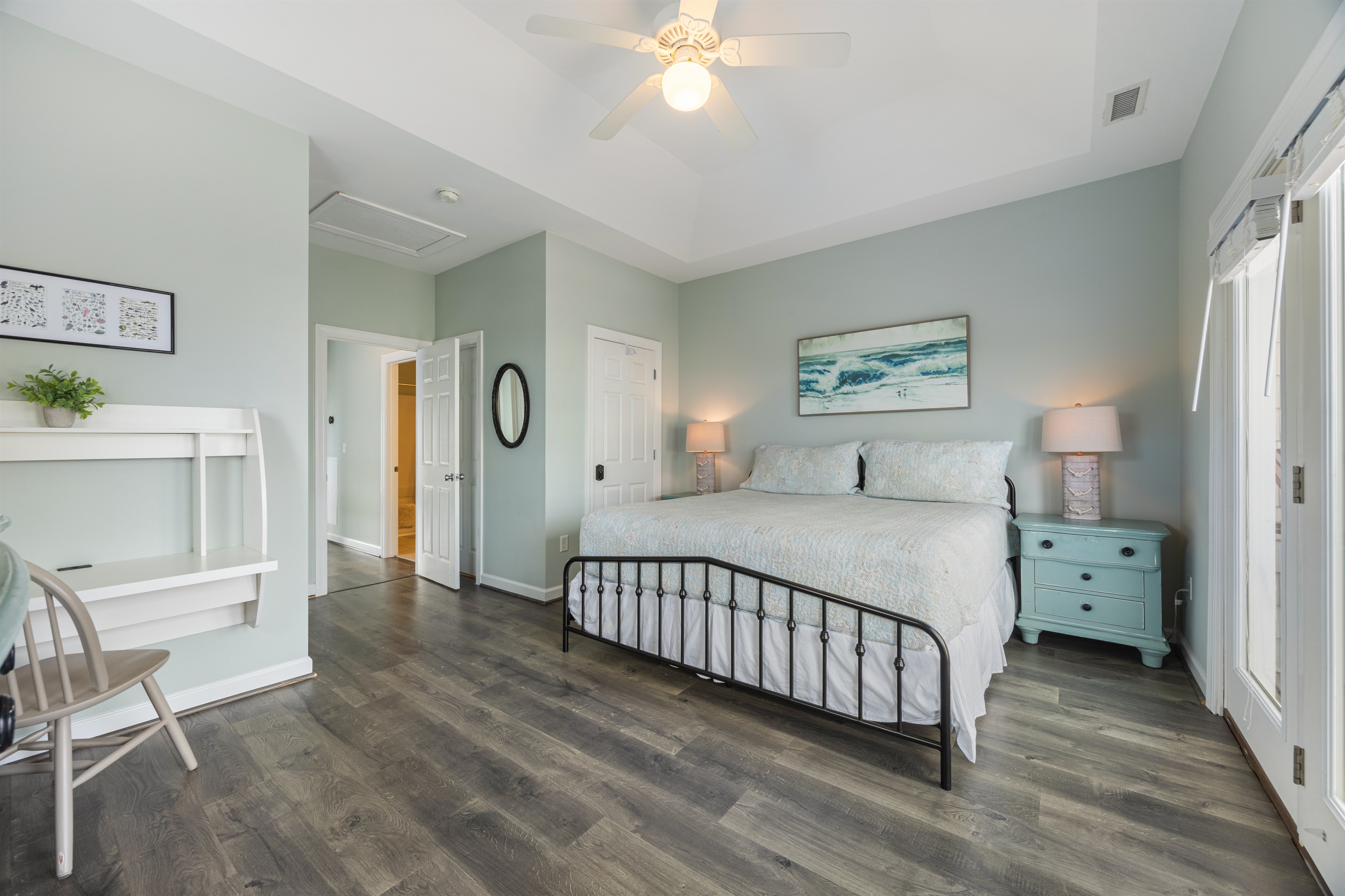 Primary bedroom with a comfortable king sized bed