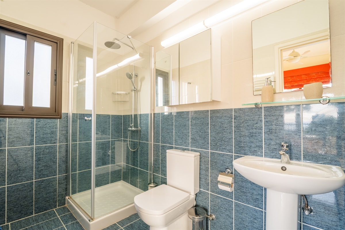 Full bathroom with walk-in shower and heated towel rails connected to the master bedroom.