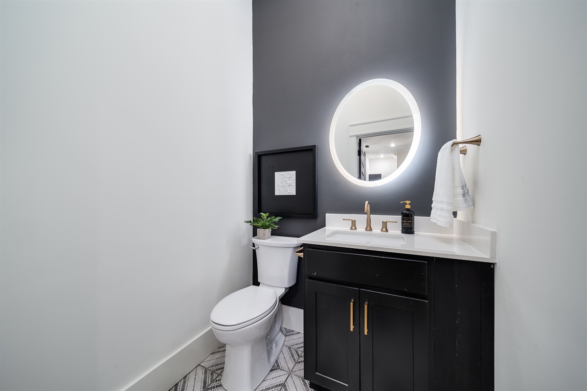 Includes a charming half-bath with a modern vanity, providing that essential extra space!