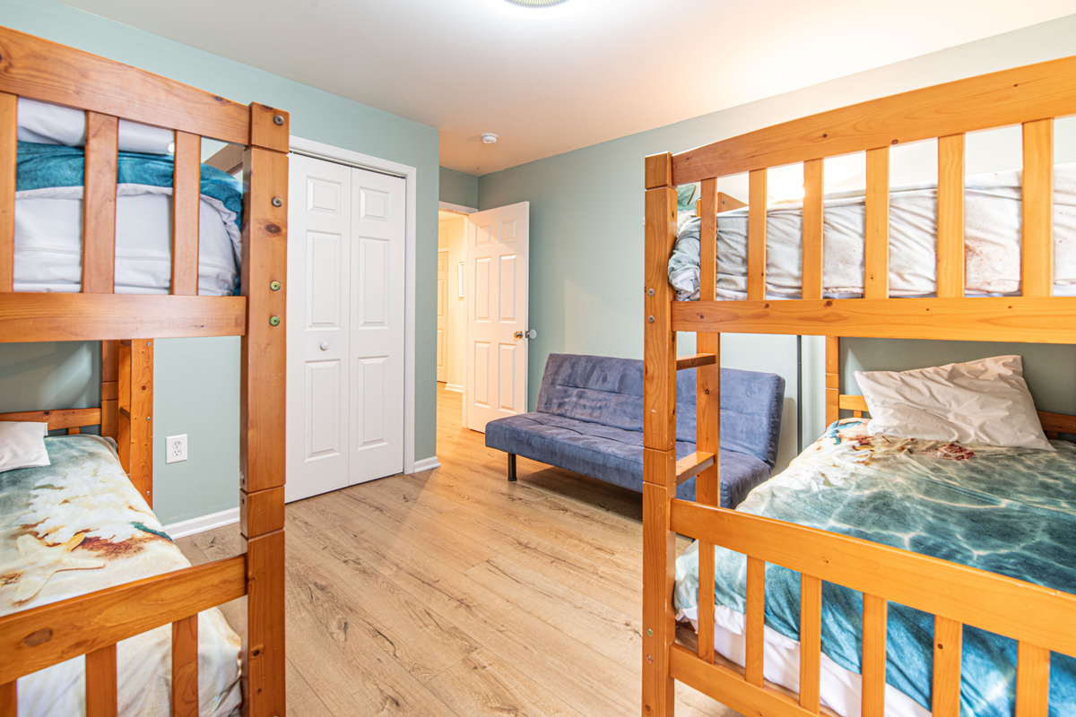 Bunk Bedroom , Futon Seating, and Dresser