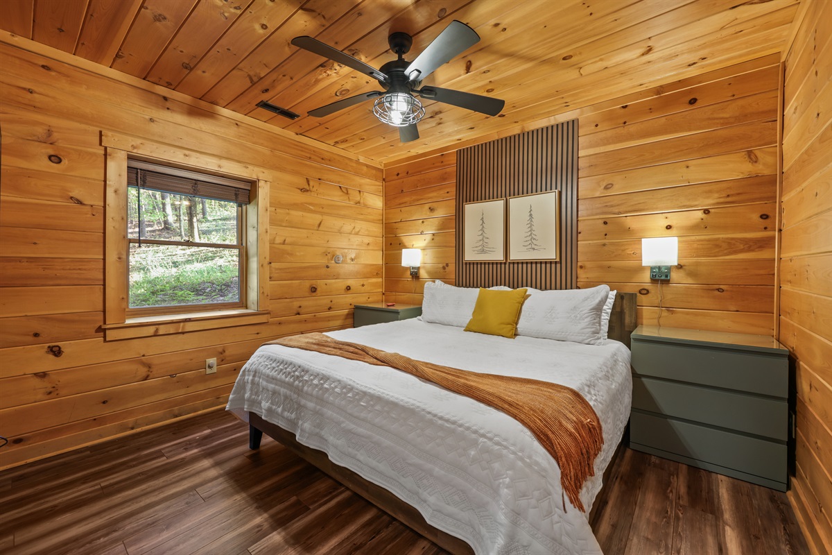 King bedroom downstairs with a 50" smart tv facing the bed
