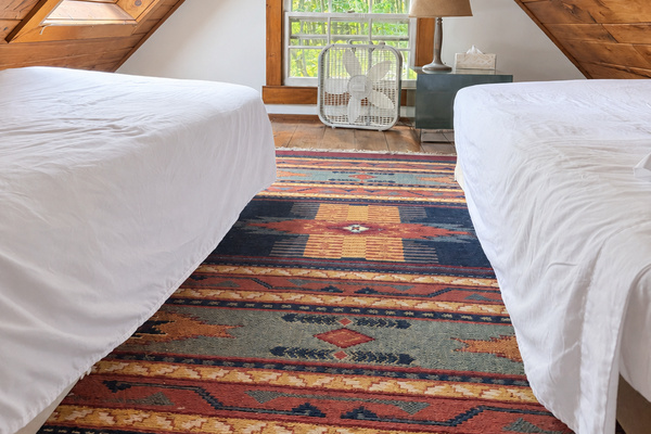 Upstairs sleeping loft with 2 twin beds and big skylight