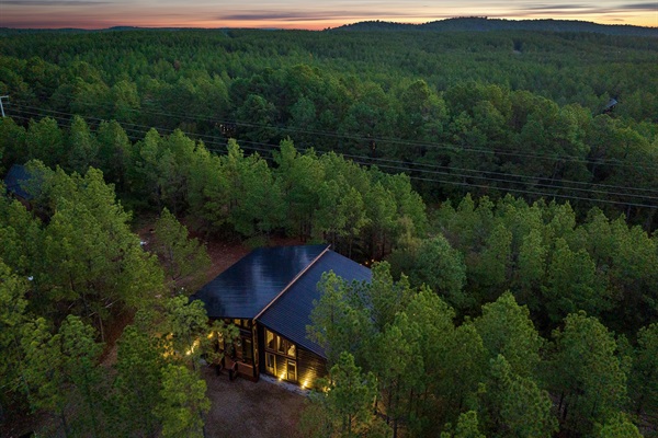 Private forest cabin with panoramic views and glowing evening skies