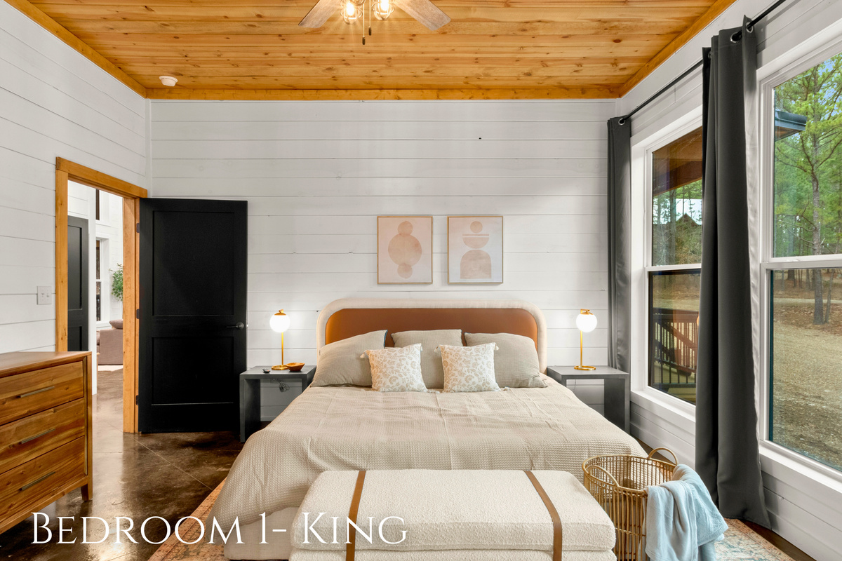 The room features a king-sized bed as the centerpiece, providing a luxurious and comfortable sleeping experience.
