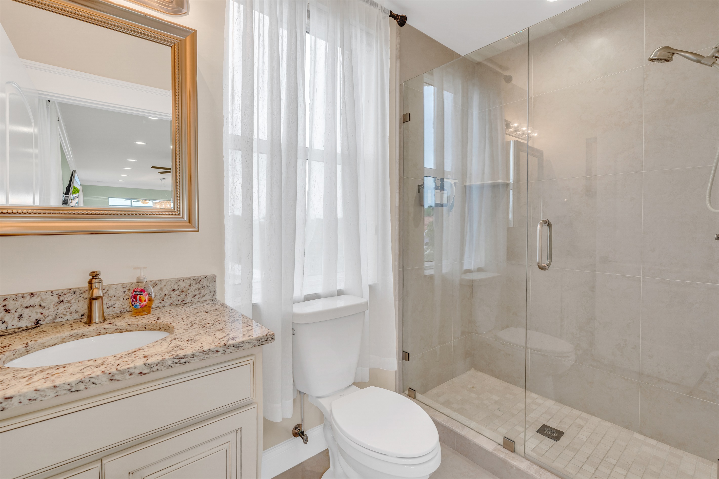 The first of three full bathrooms, located on the top floor