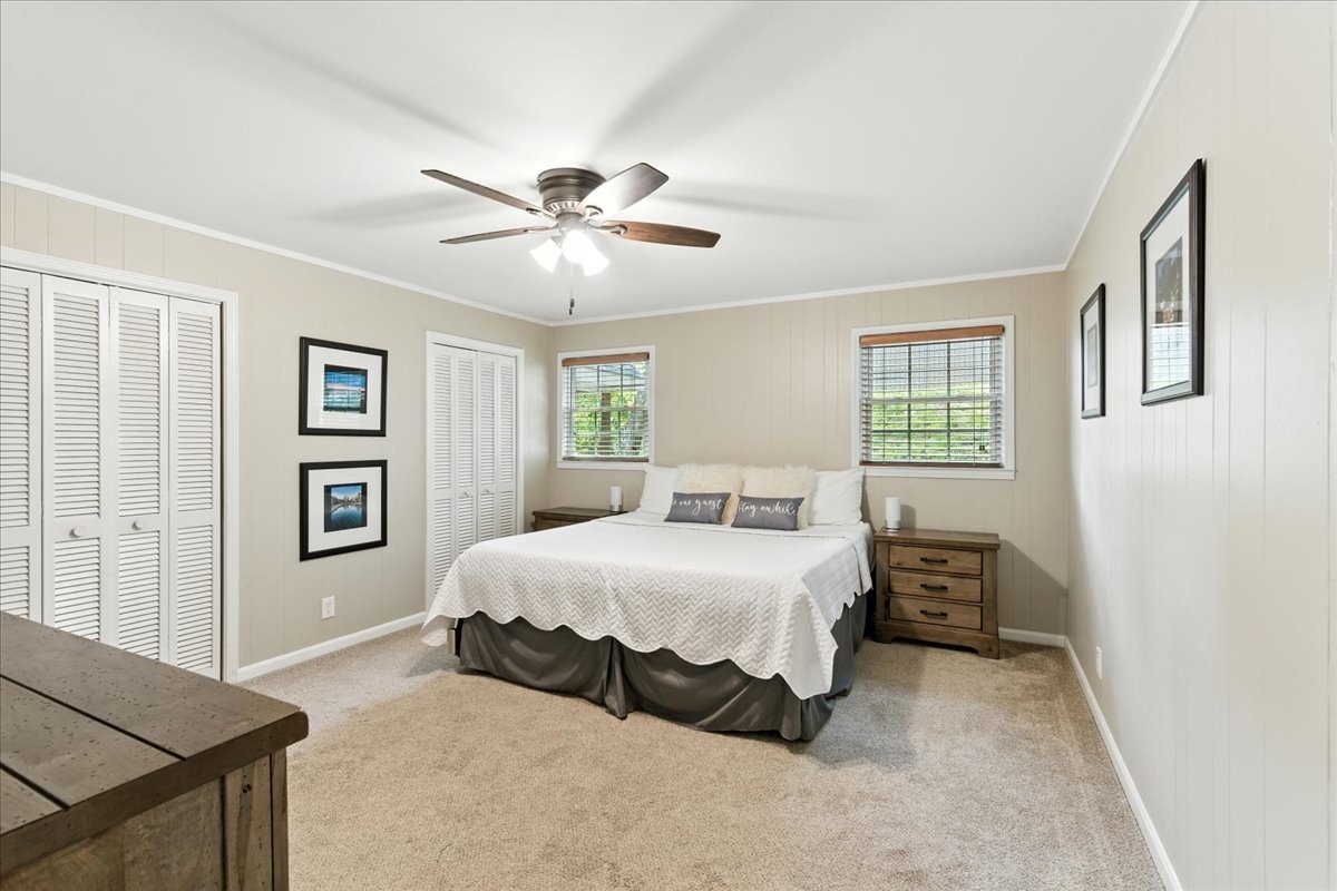 A king-size bed with soft, clean linens offers a comfortable place to rest for a good night's sleep.