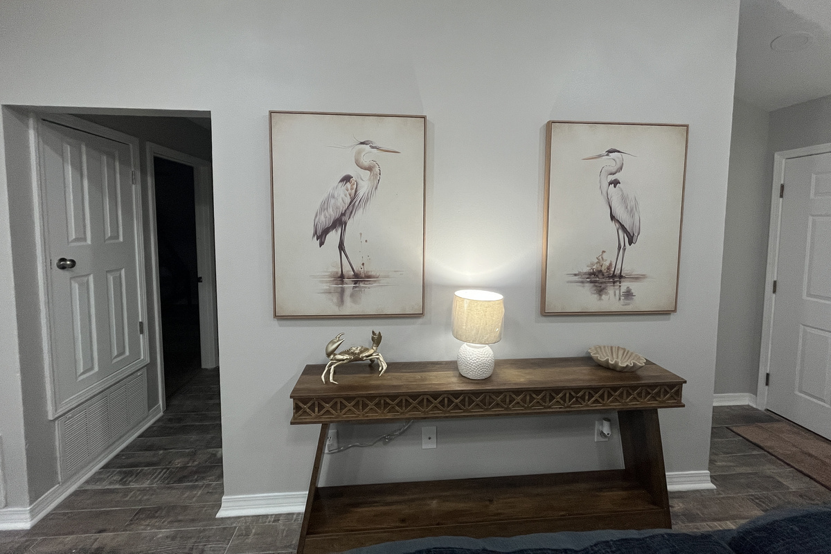 Coastal artwork brings the beach vibe home.