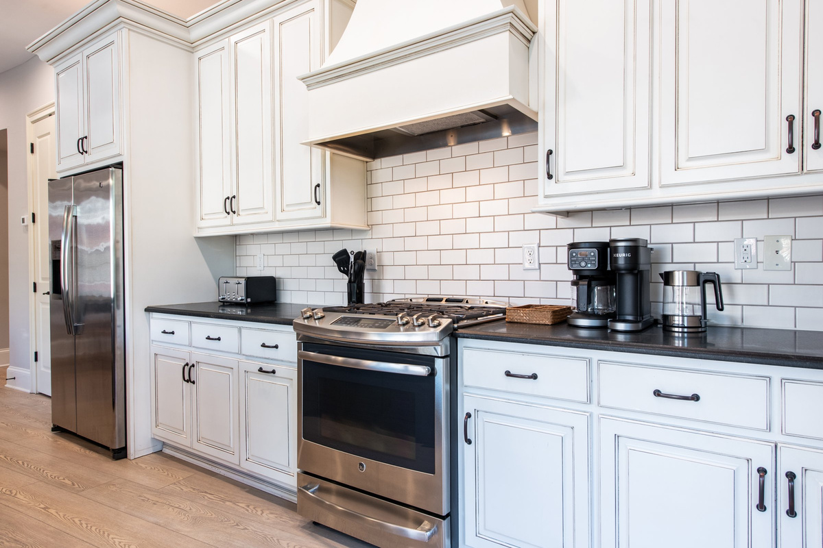 Gas range and subway tile backsplash - everything you need for a home-cooked meal.