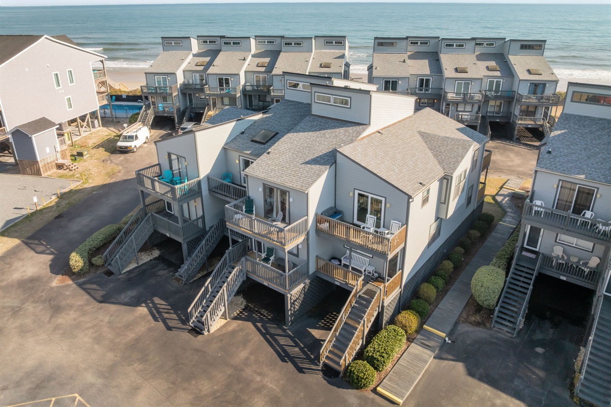 Drone view of Tide of Your Life at Shipwatch II, a beachfront community offering easy access to the Atlantic Ocean and relaxing coastal living