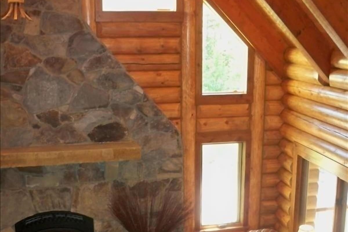 Large luxury log living room with fireplace