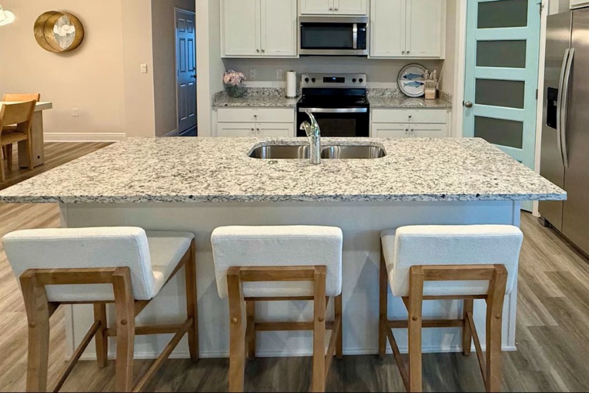 Kitchen island with bar seating—perfect for morning coffee or casual chats.