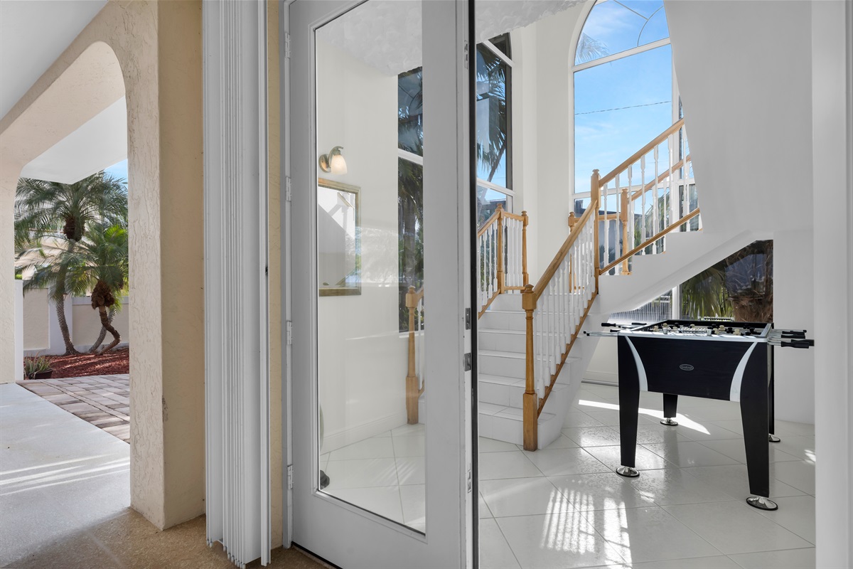 Staircase foyer with foosball table