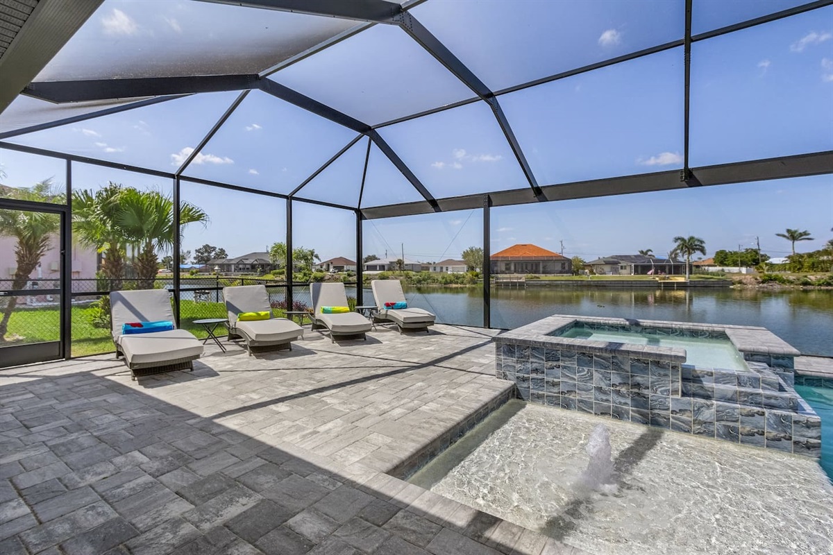 Relax and soak up the sun in the spacious lounging area with a refreshing spa!