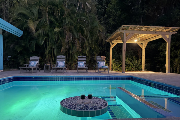 Unwind after sunset in your private tropical paradise. The pool area comes alive at night with warm gazebo lighting and glowing underwater pool lights. Sip cocktails at the unique swim-up mosaic table, lounge on the spacious deck surrounded by lush palms
