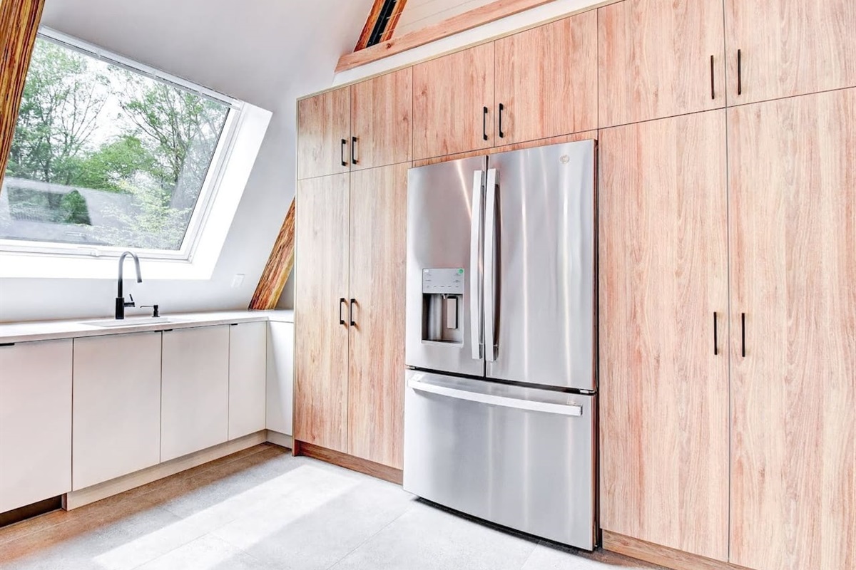 Well socked kitchen with modern appliances spices, baking essentials. 