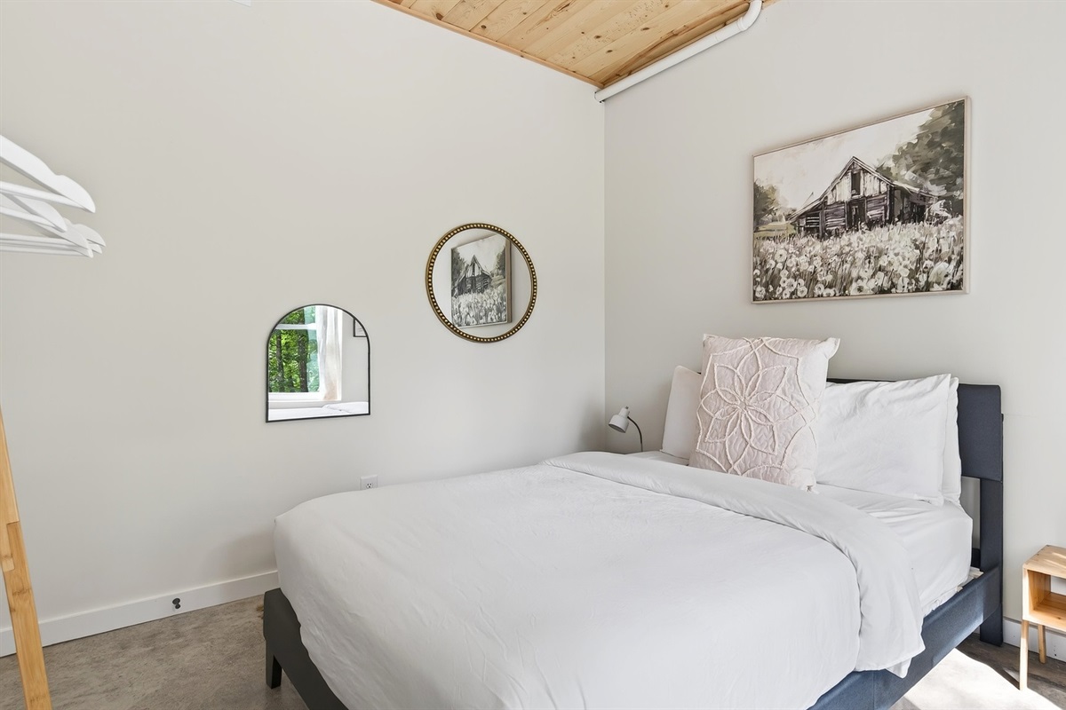 Queen bed on the lower level