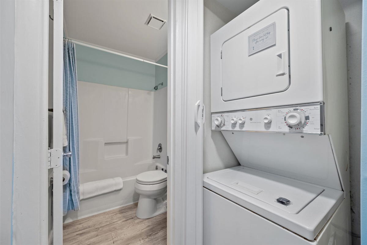 Clean and simple bathroom with tub shower combo for easy refresh after the beach