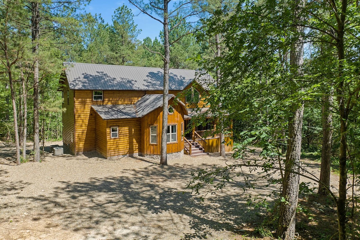 Nestled in serene forest surroundings, the cabin offers peace, privacy, and natural beauty at every glance.